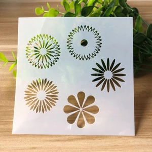 Detailed view of white semi-transparent PET plastic mandala stencils for DIY drawing