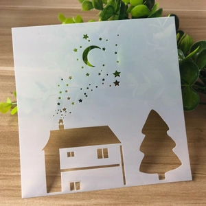 DIY hollow painting template with house and pine tree patterns for kids' art projects