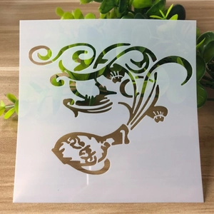 Macro detail of a white translucent plastic DIY stencil with abstract heart floral pattern