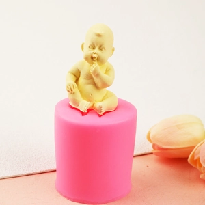Pink silicone mold with yellow baby shape for DIY cake decoration and fondant crafts