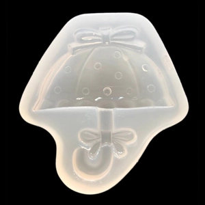 Macro detail of umbrella silicone mold with polka dots and bow for DIY resin jewelry