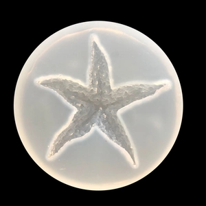 Translucent starfish silicone mold for DIY resin and candle making on a black background