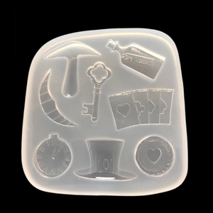 Detail of Alice in Wonderland silicone mold featuring Drink Me bottle and clock symbols