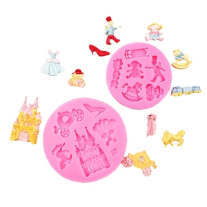 Pink silicone mold set featuring fairy tale castle, pumpkin carriage, and princess dress shapes