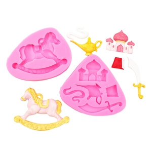 Pink silicone fondant mold set featuring castle, rocking horse, and magic lamp shapes