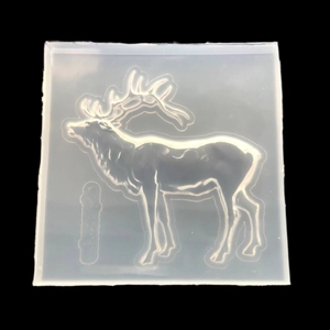 Macro detail of flexible translucent silicone mold featuring a 3D geometric reindeer shape