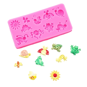 Pink silicone insect mold for DIY fondant featuring bees, frogs and butterflies