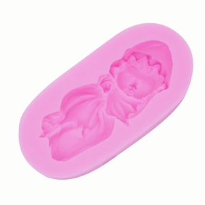 Detail of baby angel silicone mold showing intricate facial features and cloth textures