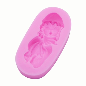Close-up of pink silicone mold with detailed sleeping baby angel design for DIY crafts