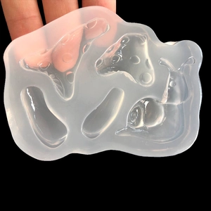 Translucent silicone mold featuring mushroom and snail shapes for DIY resin crafts
