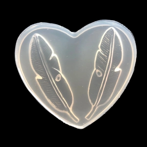 Translucent heart-shaped silicone mold with feather patterns for DIY resin crafts