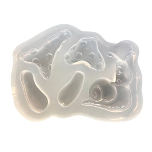 Clear silicone mold featuring detailed mushroom and snail shapes for DIY resin crafts