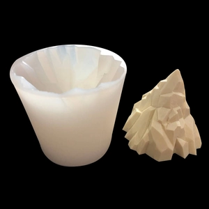 Detail view of flexible 3D iceberg silicone mold with finished geometric mountain sculpture
