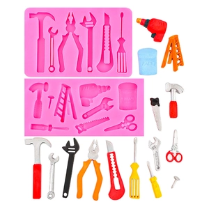 Pink silicone cake mold set featuring detailed miniature hardware tools and ladder shapes