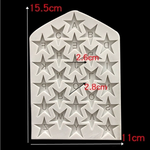 Macro detail of star-shaped silicone mold showing alphabet letters and dimensions