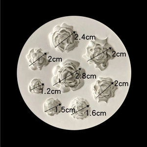 White silicone rose mold with 8 cavities ranging from 1.2cm to 2.8cm for fondant or clay