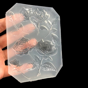 Translucent silicone mold for UV resin featuring intricate blooming rose and leaf patterns