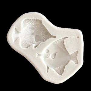 Silicone mold for baking and DIY featuring two detailed kissing tropical fish shapes