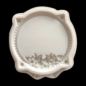 Macro view of white silicone mold featuring a detailed rose relief for DIY craft resin