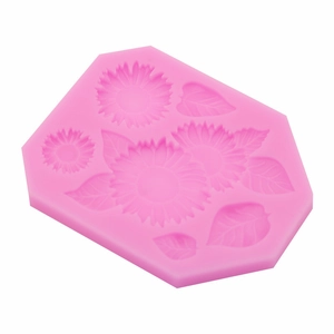 Pink silicone mold with sunflower and leaf patterns for fondant cake and resin crafts