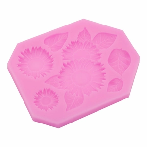 Pink hexagonal sunflower silicone mold for fondant cake and clay crafting on white background