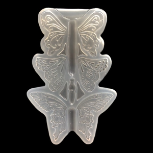 Macro view of translucent silicone butterfly molds for DIY epoxy resin craft pendants