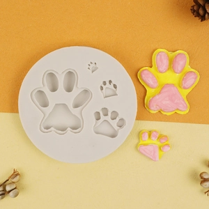 Silicone mold set featuring four paw-shaped cavities for DIY chocolate and fondant making