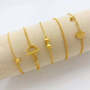 Adjustable 24K gold plated brass bracelets set with various charms and chain styles