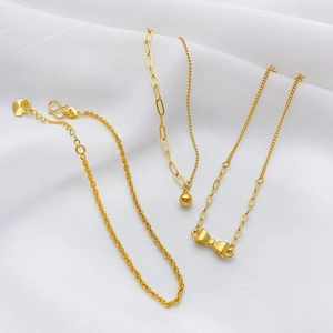 24K gold plated adjustable jewelry chains with butterfly and heart charms on white silk