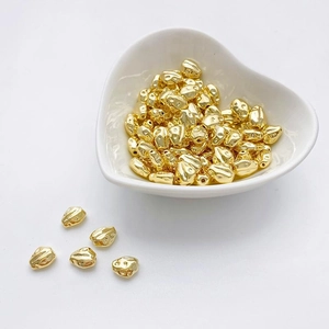 Cuentas espaciadoras barrocas irregulares bañadas en oro de 14K para joyería DIY en plato