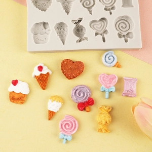 White silicone candy ice cream mold with colorful resin samples on a soft pastel background
