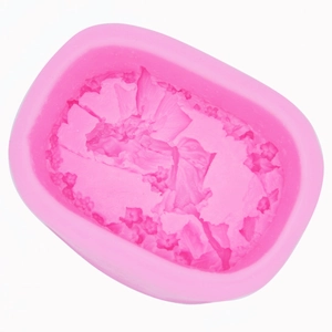 Pink silicone mold with rectangular rounded corners and floral relief for DIY soap making