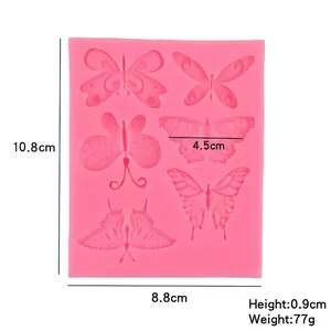 Moule en silicone papillon pour décoration de gâteaux et pâtisserie DIY sur fond blanc