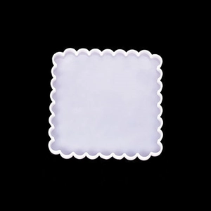 Detail of light purple wavy square silicone resin mold on a black background