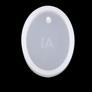 Macro shot of oval silicone mold with 1A engraving for DIY crystal resin pendants