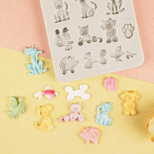 Detailed animal shapes silicone mold with cat, dog, and fish fondant decorations