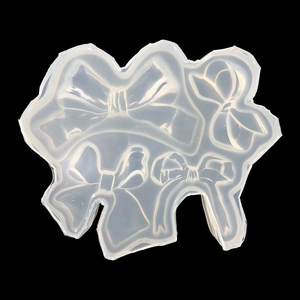 Stampo in silicone traslucido con quattro forme di fiocchi per gioielli e artigianato