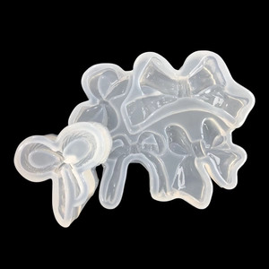 Stampo in silicone traslucido con diverse forme di fiocchi per creazioni in resina e fai-da-te