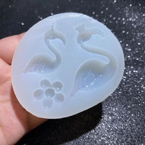 Detailed view of flexible silicone flamingo and flower mold for DIY resin crafts