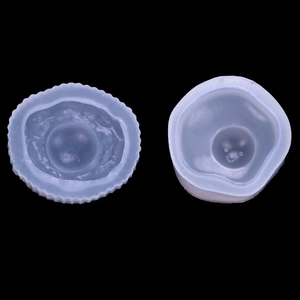 Detailed view of translucent silicone molds featuring smiley face and textured designs
