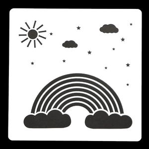 Macro view of white plastic stencil featuring sun, cloud, stars and rainbow design