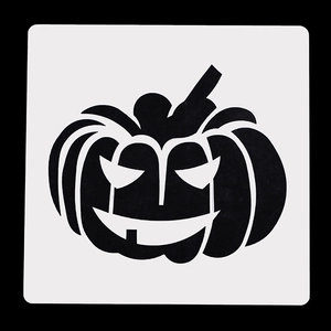 Macro detail of high-contrast white Halloween pumpkin stencil on black background