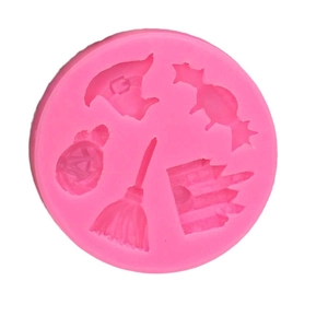 Pink silicone Halloween baking mold with witch hat, pumpkin and castle shapes