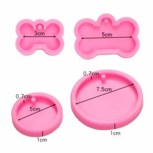 Pink silicone dog bone and circle molds for keychains and pendants with size details