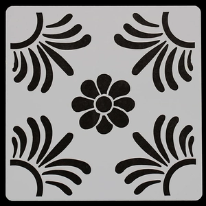 Macro detail of square mandala painting stencil with floral and feather patterns