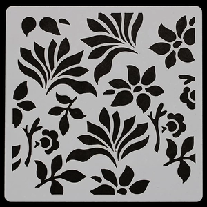 Close-up of square DIY stencil with intricate floral and botanical cutout patterns