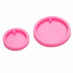 Pink round silicone molds in two sizes for DIY resin keychains and scented tags