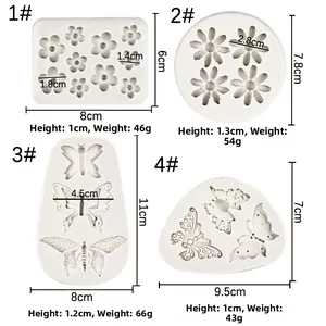 Detailed views of silicone molds for daisy and butterfly shaped cake fondant decorations