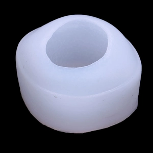 Detail of a round white silicone mold for 3D lemon shaped candles and aromatherapy