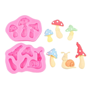 Pink silicone snail and mushroom fondant molds for fairy tale cake decorations